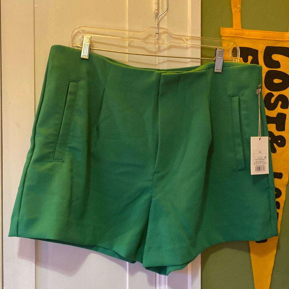 two pairs of size 14 Midi Shorts 4” inseam stretchy and pleated